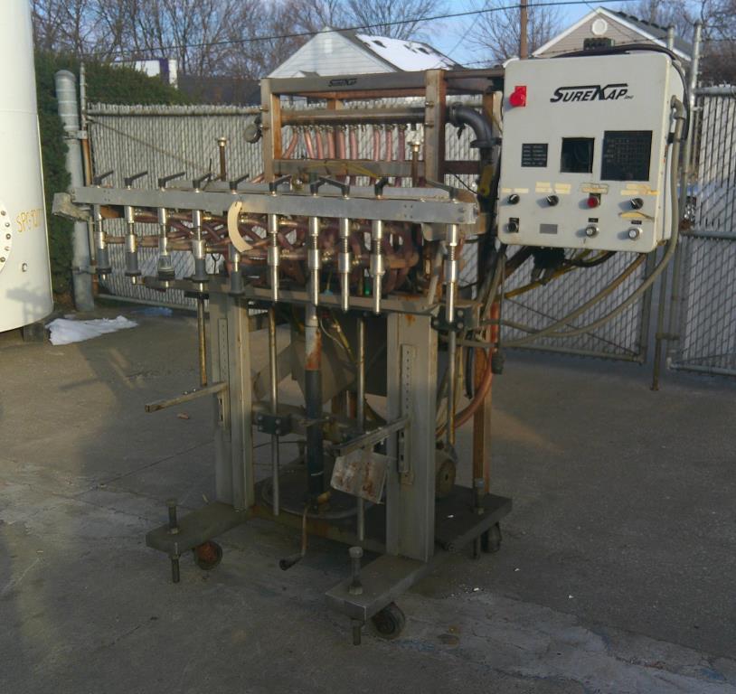 Filler 12 valve SureKap liquid pressure filler model SKF5000