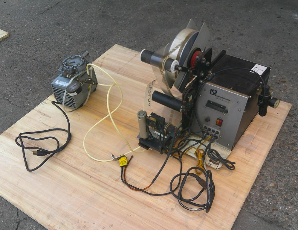 Labeling equipment LSI Labeling Systems pressure sensitive labeler model 306, tamp-on